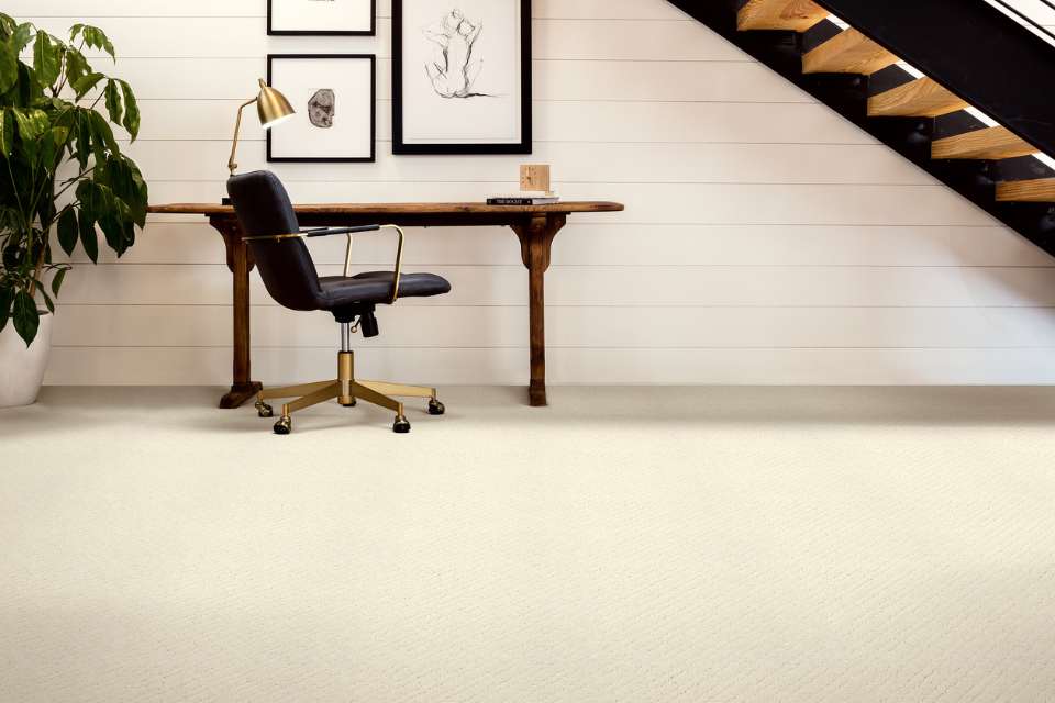white cut and loop patterned carpet in modern office under the stairs